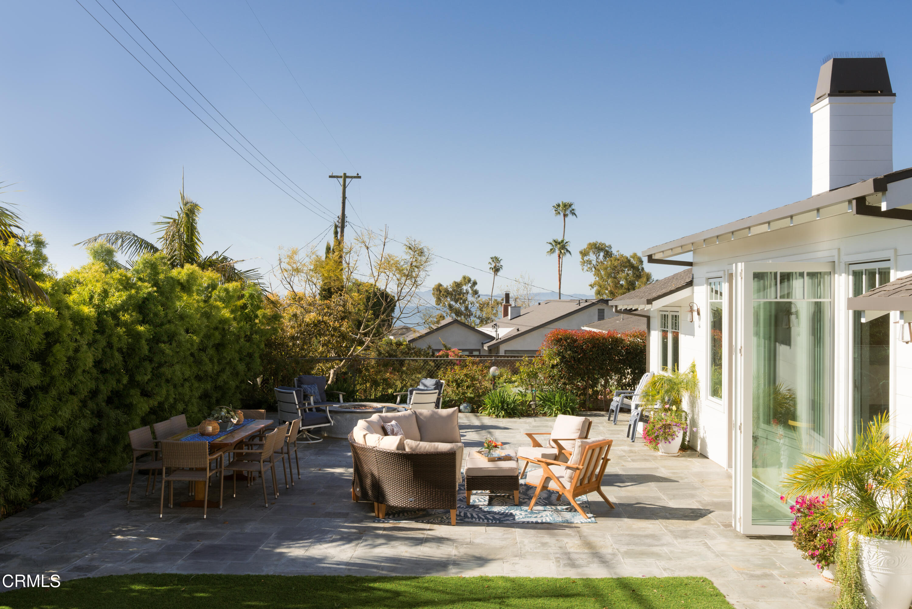 330 Salida Del Sol Santa Barbara, CA 93109 - Photo 34 of 39 a view of a patio with table and chairs potted plants