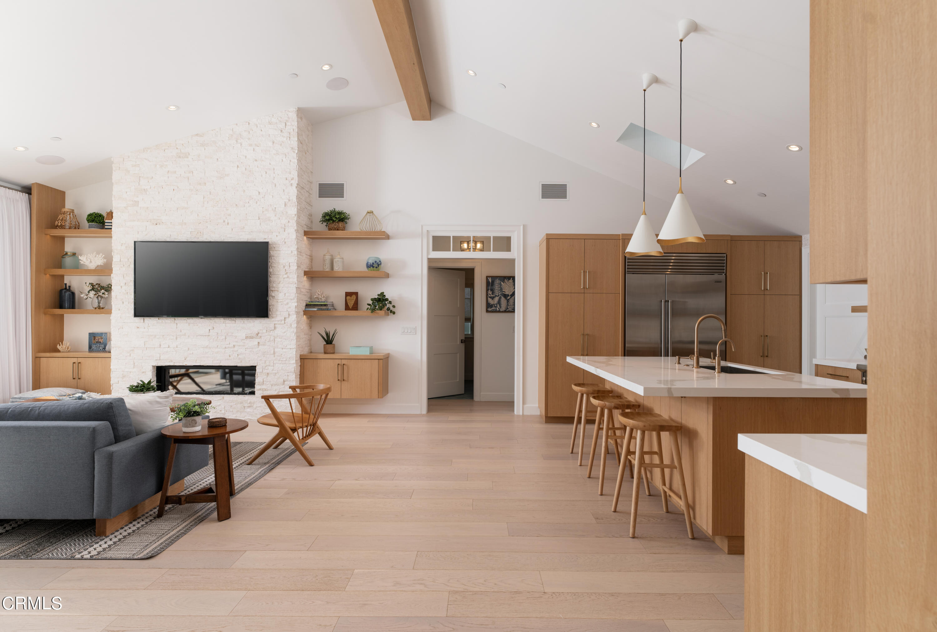 330 Salida Del Sol Santa Barbara, CA 93109 - Photo 4 of 39 a living room with furniture a flat screen tv and a refrigerator