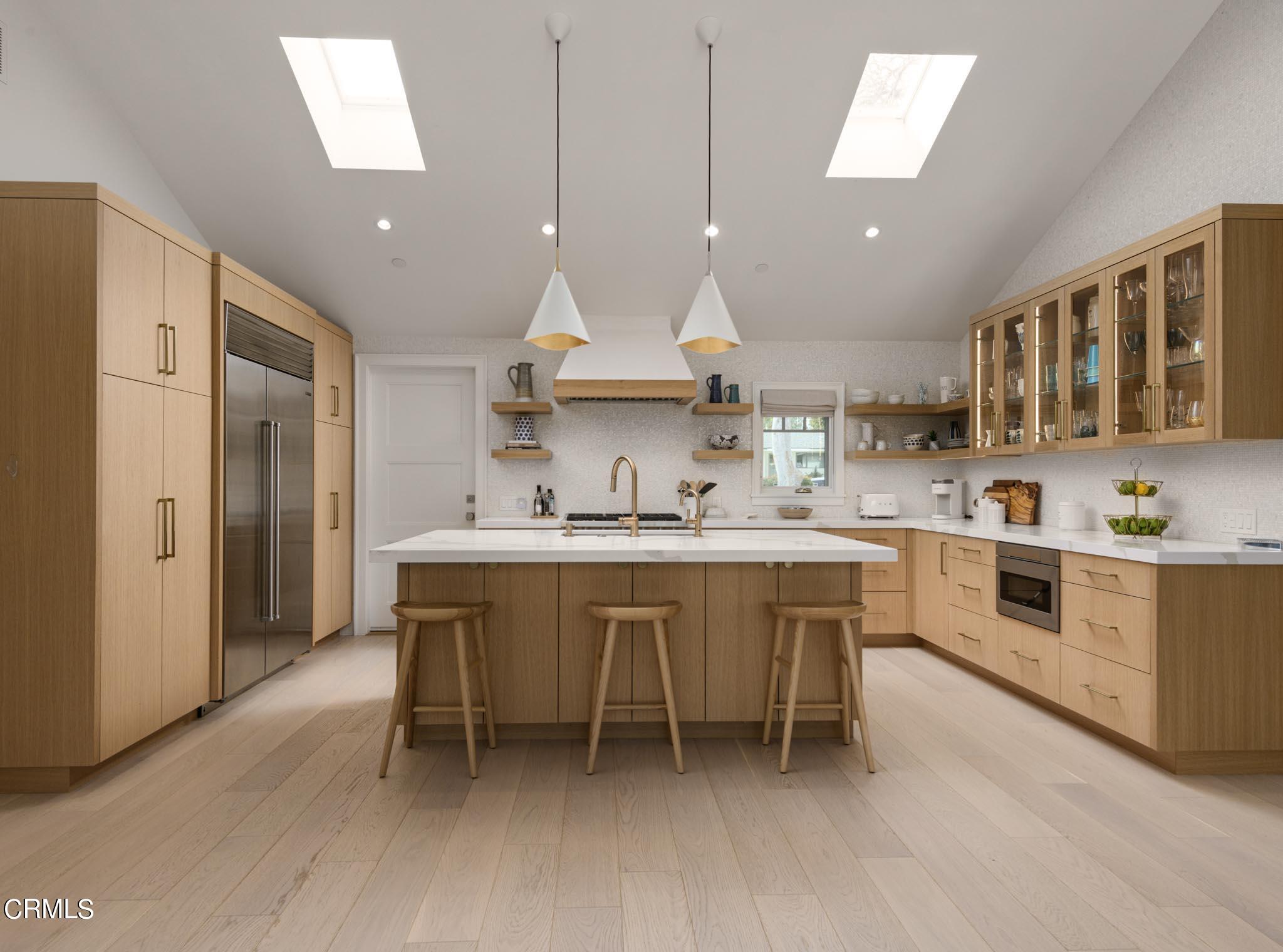330 Salida Del Sol Santa Barbara, CA 93109 - Photo 9 of 39 a kitchen with a sink stainless steel appliances and cabinets