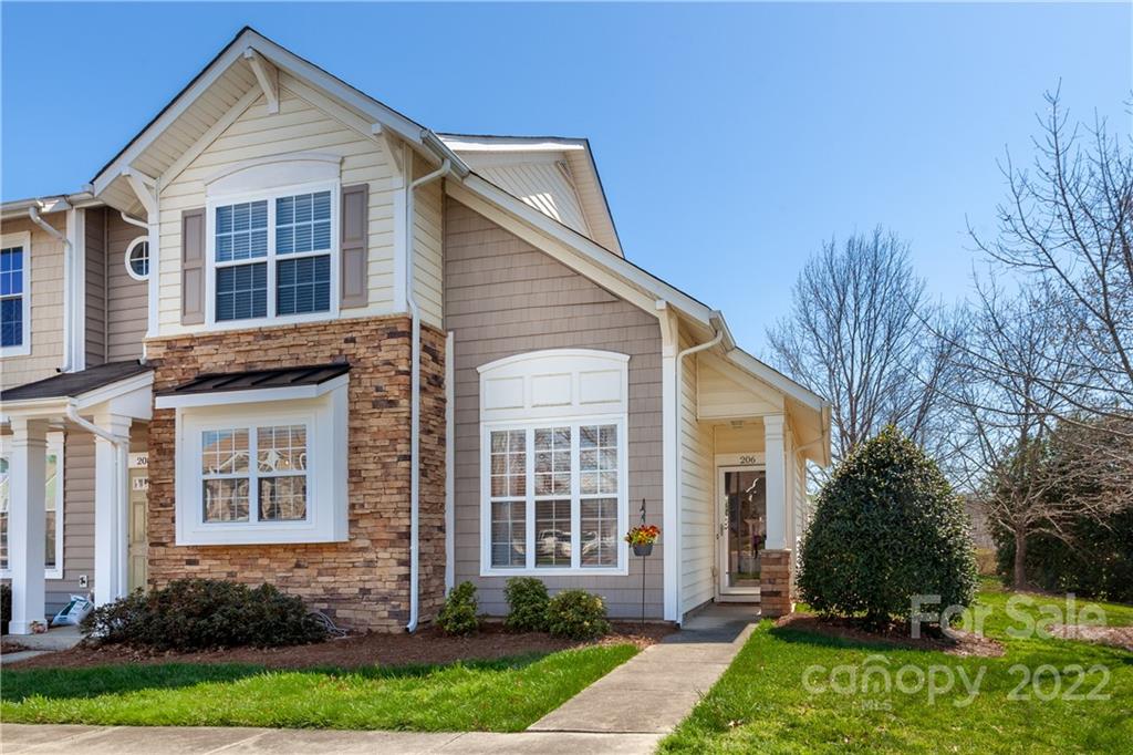 206 Dawn Mist Lane, Unit 28 Fort Mill, SC 29708 - Photo 1 of 39 a front view of a house with a yard