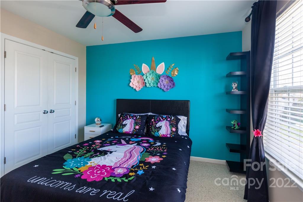 206 Dawn Mist Lane, Unit 28 Fort Mill, SC 29708 - Photo 24 of 39 a bed room with furniture and a fireplace