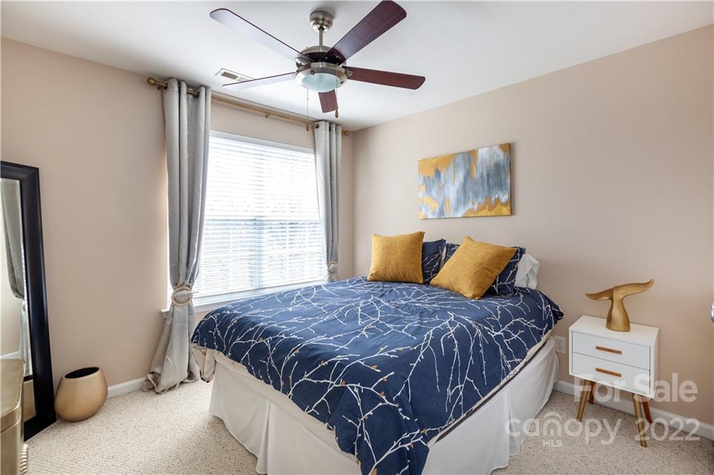 206 Dawn Mist Lane, Unit 28 Fort Mill, SC 29708 - Photo 26 of 39 a bedroom with a bed and a window