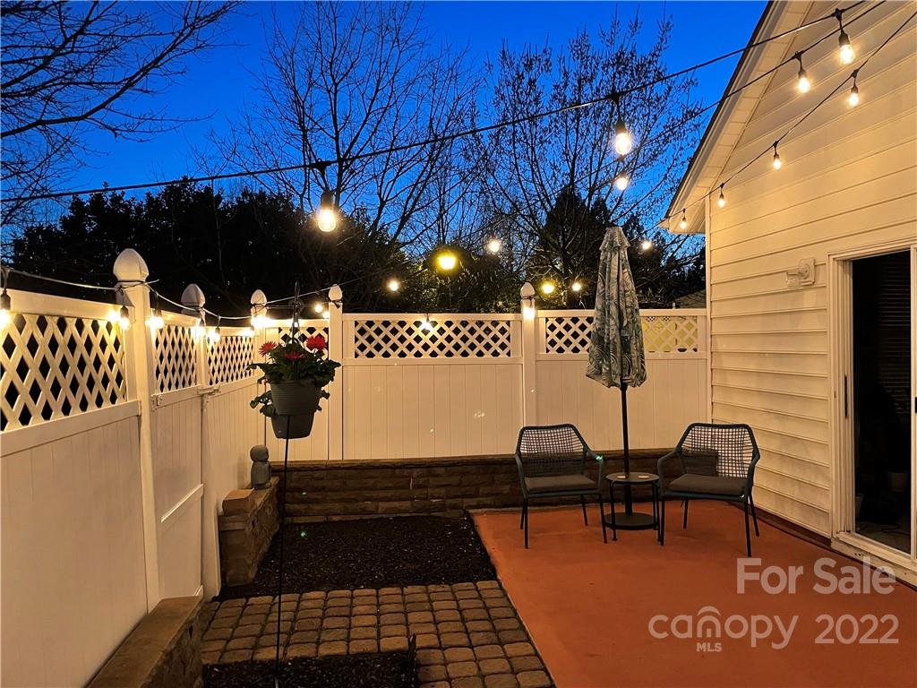 206 Dawn Mist Lane, Unit 28 Fort Mill, SC 29708 - Photo 35 of 39 a backyard of a house with table and chairs