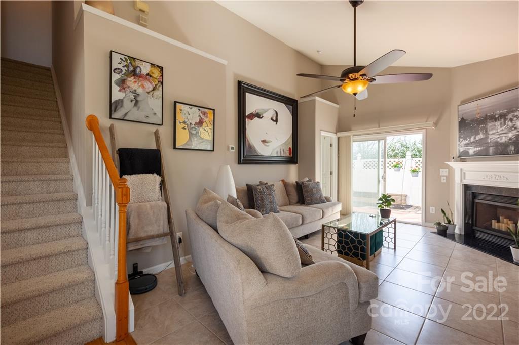 206 Dawn Mist Lane, Unit 28 Fort Mill, SC 29708 - Photo 5 of 39 a living room with furniture a fireplace and a window