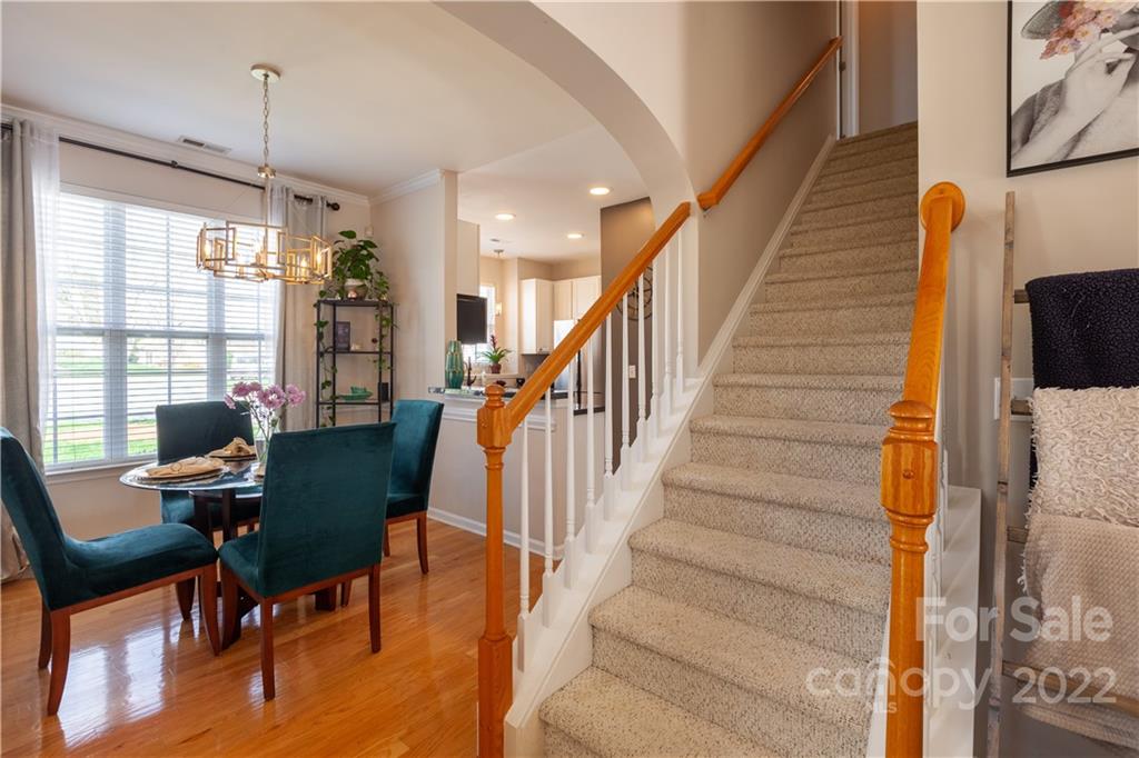 206 Dawn Mist Lane, Unit 28 Fort Mill, SC 29708 - Photo 8 of 39 a living room with furniture and a potted plant