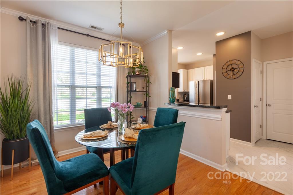 206 Dawn Mist Lane, Unit 28 Fort Mill, SC 29708 - Photo 9 of 39 a view of a dining room with furniture window and outside view