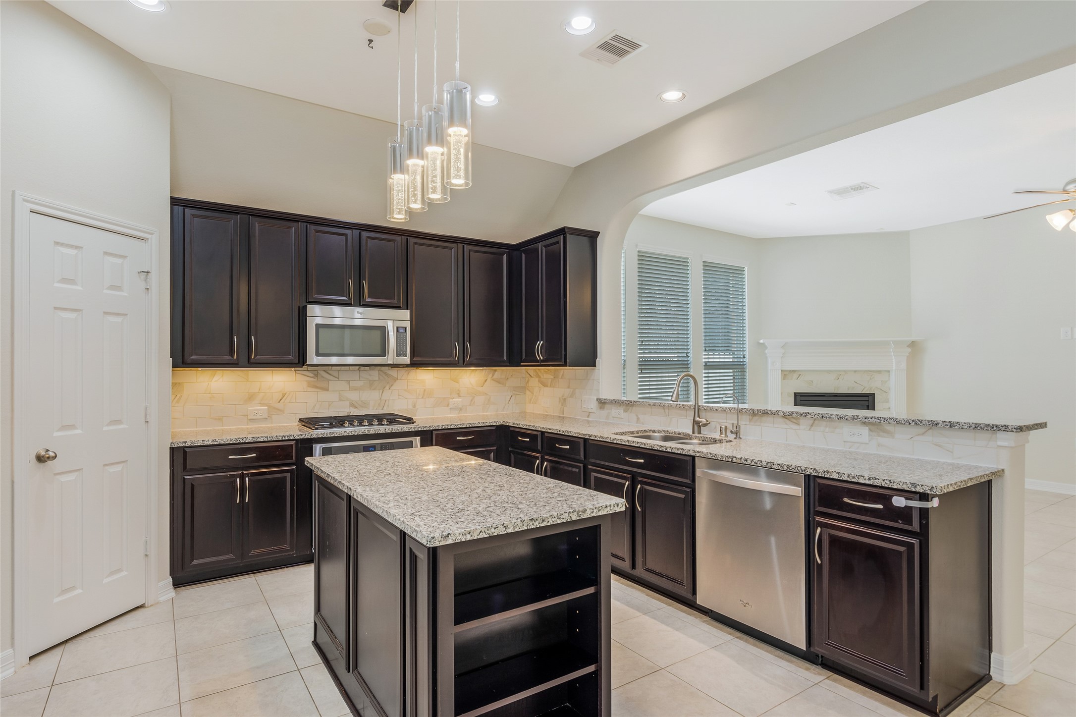 19906 Durwood Pines Lane Cypress, TX 77433 - Photo 11 of 26 a kitchen with a stove sink and cabinets