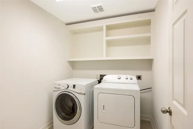 a view of bathroom with a sink mirror and shower