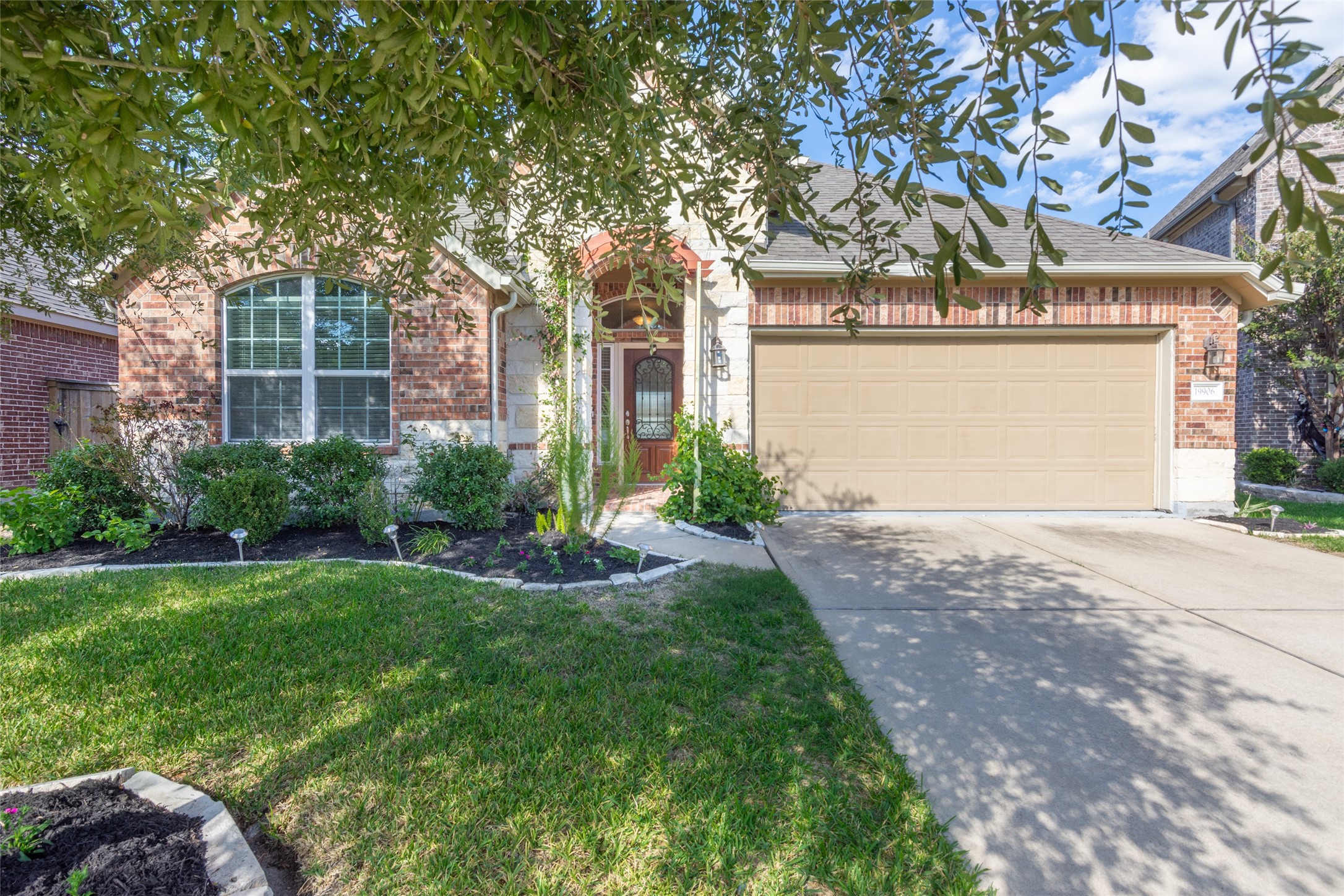 19906 Durwood Pines Lane Cypress, TX 77433 - Photo 2 of 26 a front view of a house with garden and trees