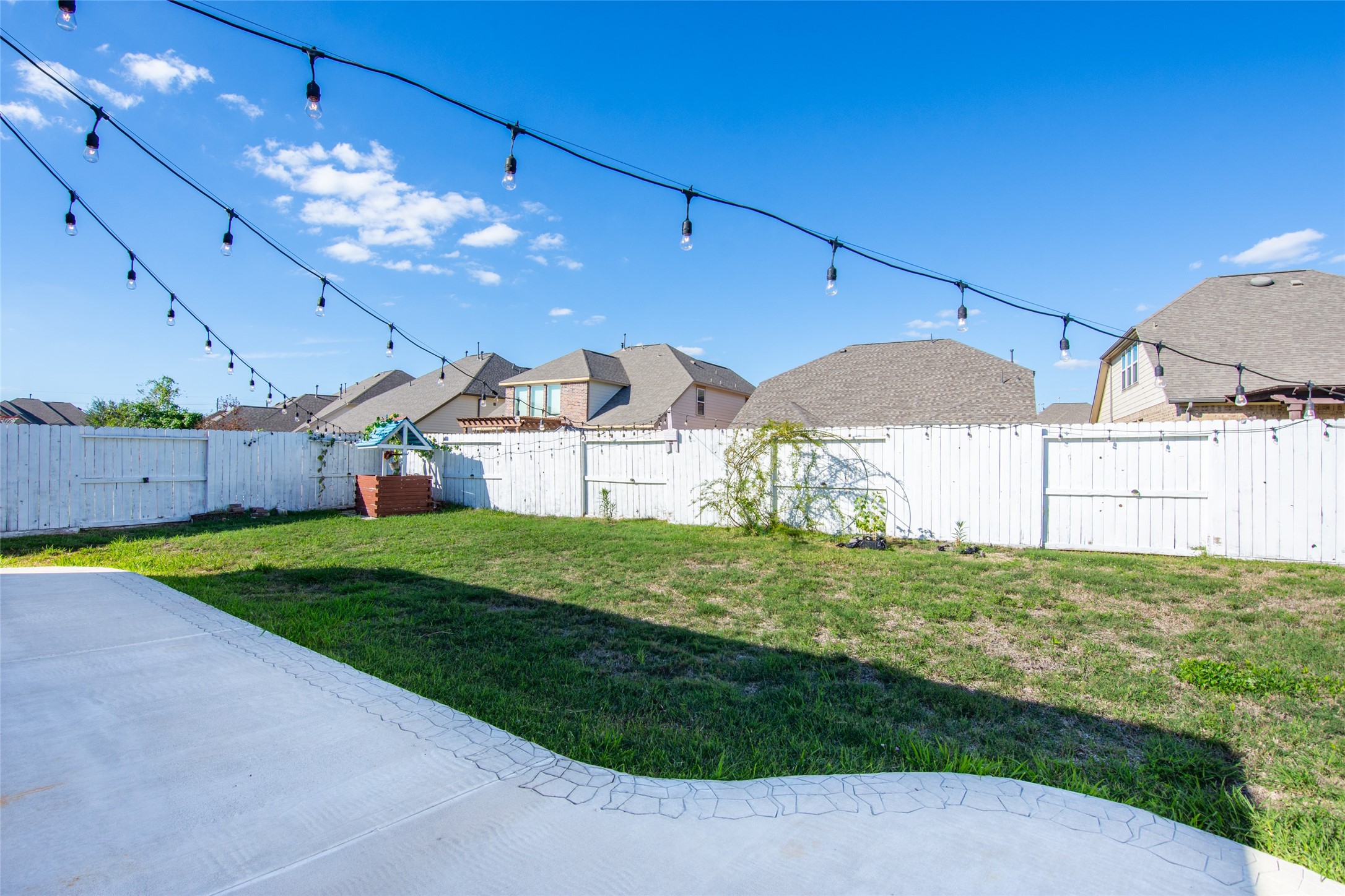 19906 Durwood Pines Lane Cypress, TX 77433 - Photo 23 of 26 a view of a backyard with plants and a patio
