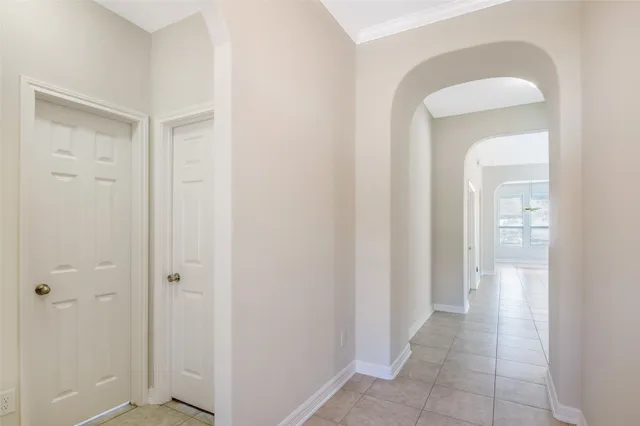 a view of a hallway with a wooden floor
