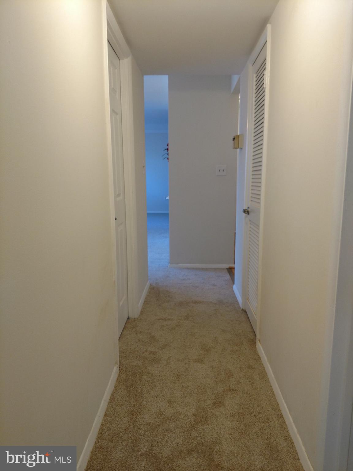 3754 Bel Pre Road, Unit 8 Silver Spring, MD 20906 - Photo 28 of 36 Wide hallway back to living room