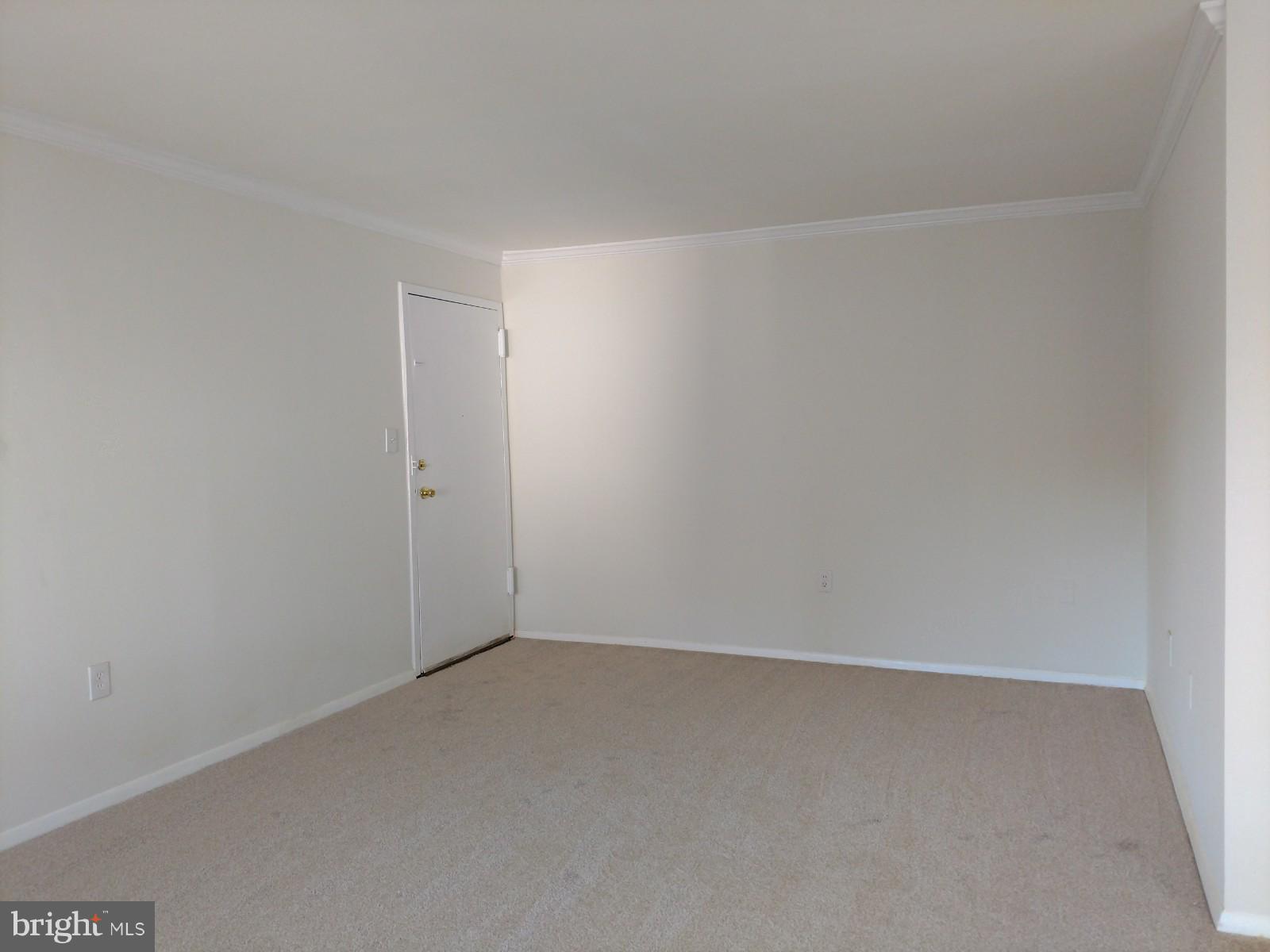 3754 Bel Pre Road, Unit 8 Silver Spring, MD 20906 - Photo 32 of 36 Living room view to the entrance-crown molding