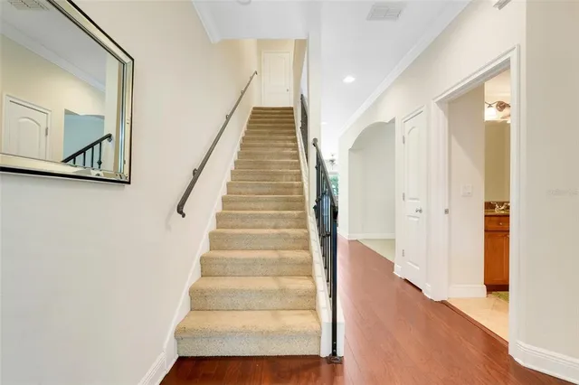 a view of an entryway with wooden floor