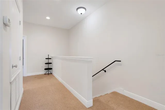 a view of room with stairs and a closet