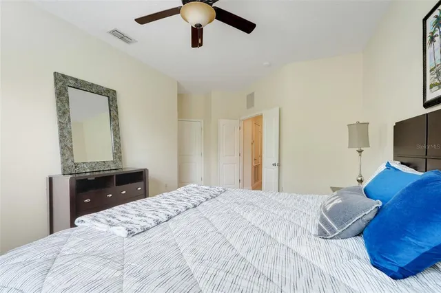 a bedroom with a bed and a tv