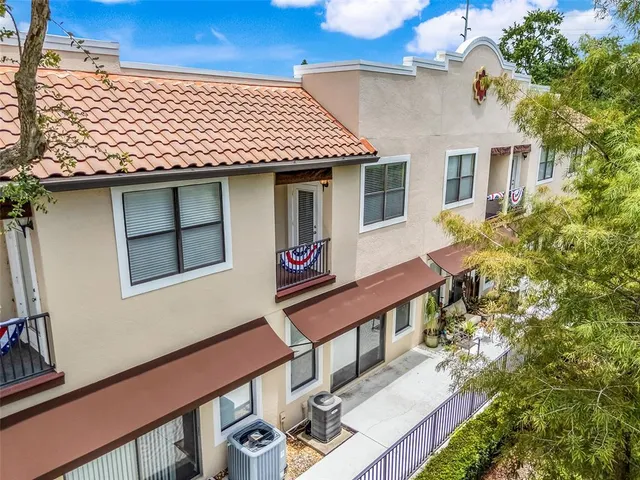 a front view of a house with large windows