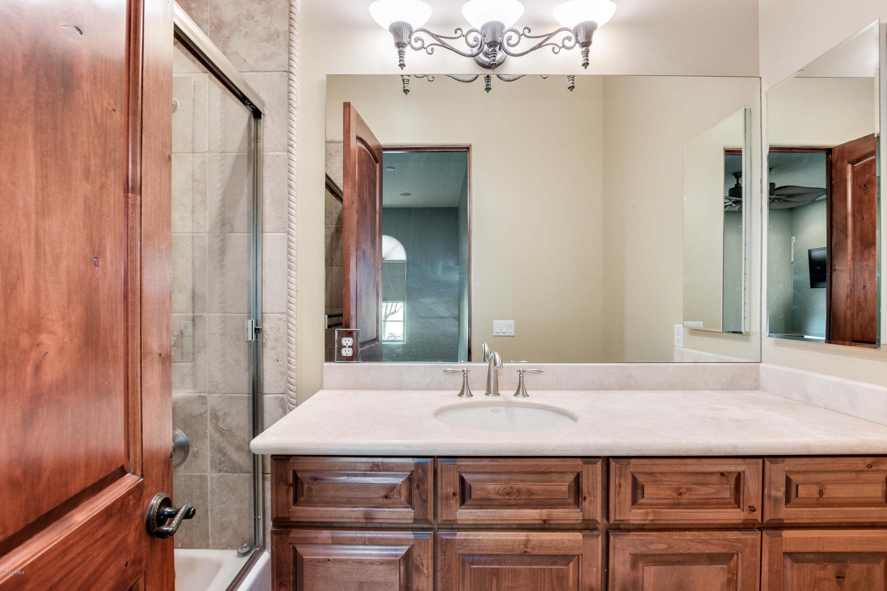 12327 East Doubletree Ranch Road Scottsdale, AZ 85259 - Photo 36 of 79 a bathroom with a sink and a mirror