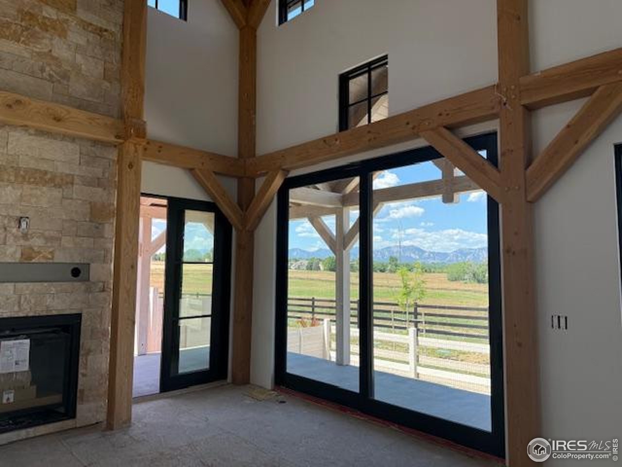 925 Latigo Loop Lafayette, CO 80026 - Photo 4 of 7 a view of an empty room with a fireplace