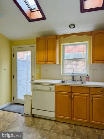 a spacious bathroom with a sink a mirror and a bathtub