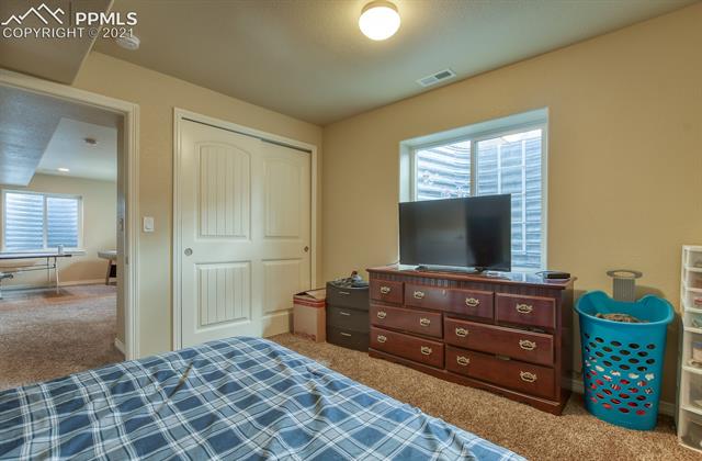 6218 Pilgrimage Road Colorado Springs, CO 80925 - Photo 37 of 42 Basement bedroom