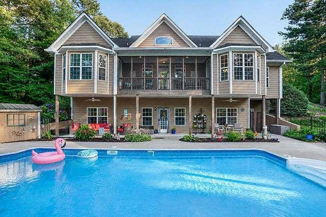 8179 Pineview Court Villa Rica, GA 30180 - Photo 38 of 41 a front view of a house with swimming pool and porch