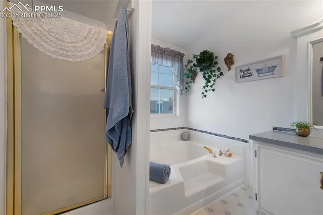 a bathroom with a tub and a sink