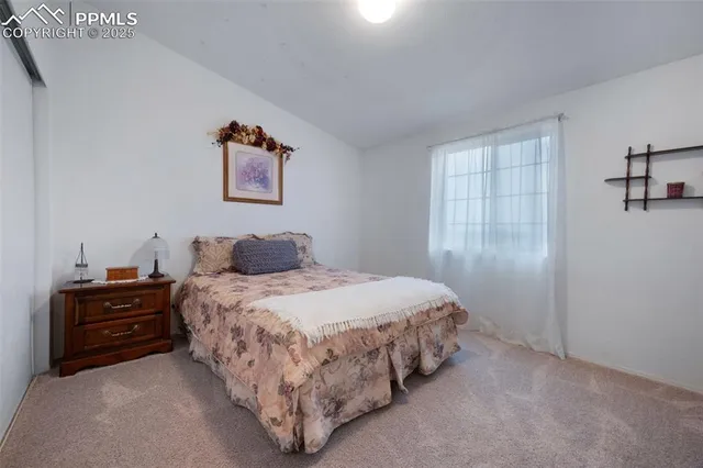 a bedroom with a bed and dresser