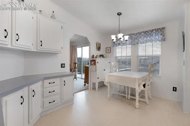 a kitchen that has a lot of windows in it
