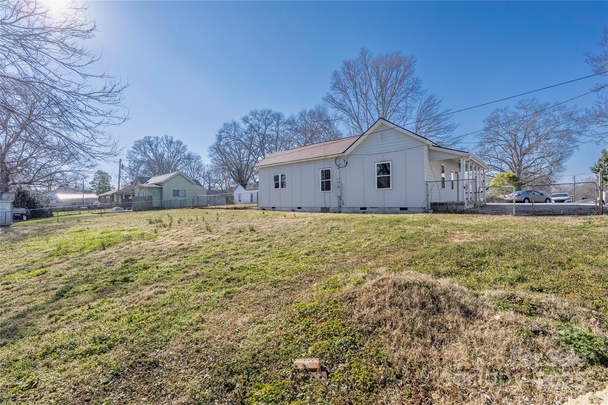 528 6th Street Chester, SC 29706 - Photo 30 of 31 a house that is sitting in the grass with large trees