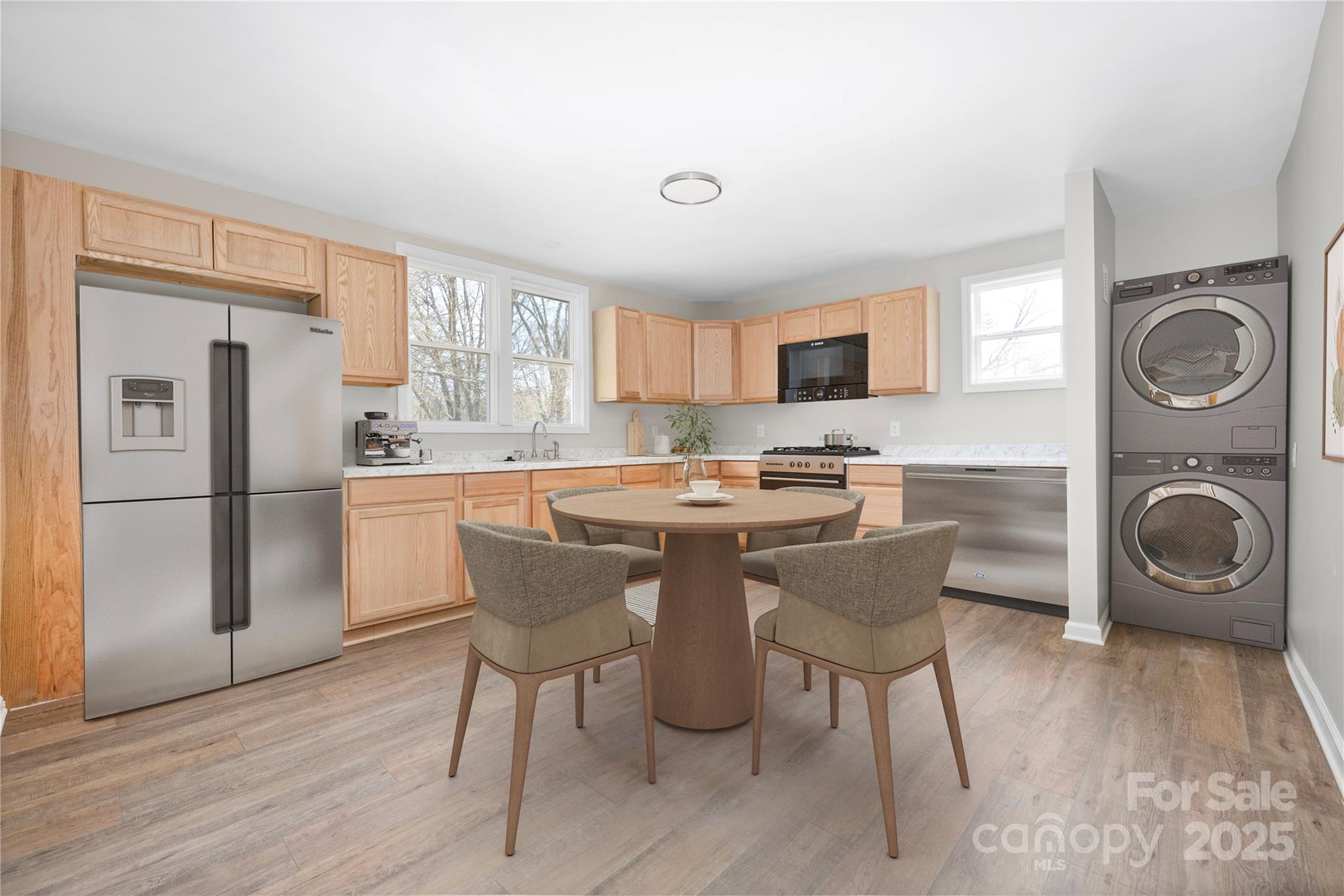 528 6th Street Chester, SC 29706 - Photo 5 of 31 a kitchen with stainless steel appliances granite countertop a refrigerator a stove top oven a sink dishwasher and white cabinets with wooden floor