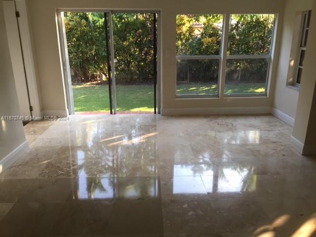 2424 Southwest 21st Street Miami, FL 33145 - Photo 8 of 9 a view of a glass door with a yard