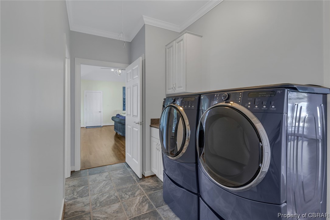 192 Bayberry Point Lane Kilmarnock, VA 22482 - Photo 32 of 49 Washroom featuring tile floors, ornamental molding, and washer and dryer