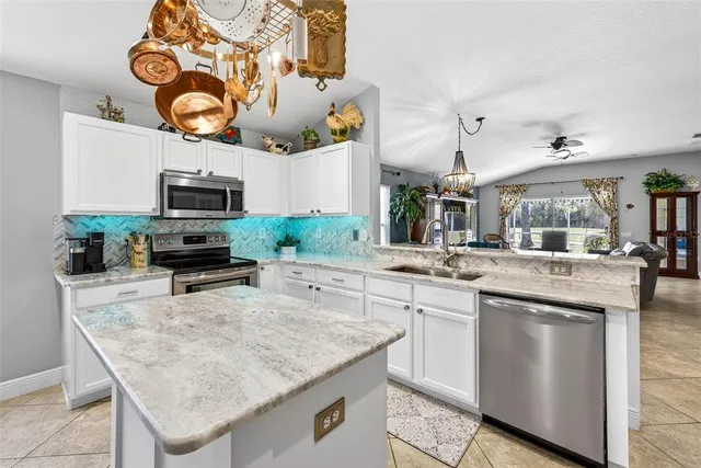 a kitchen with cabinets and window