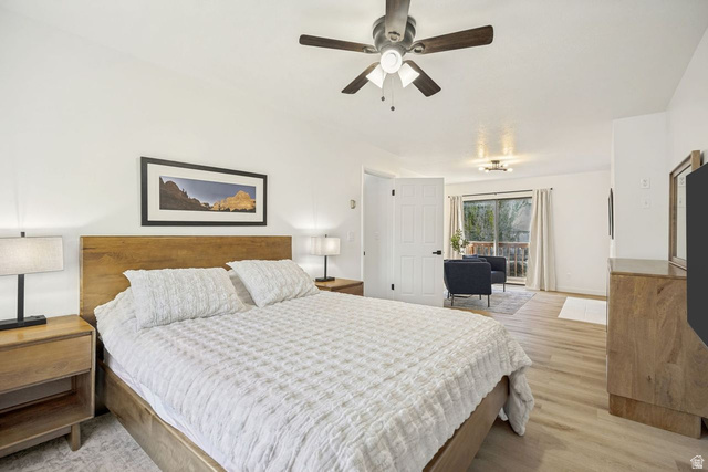 1723 Albury Road Sandy, UT 84092 - Photo 8 of 23 Spacious room featuring wood-finish flooring, a ceiling fan with light fixture, and a sliding glass door leading to an outdoor area