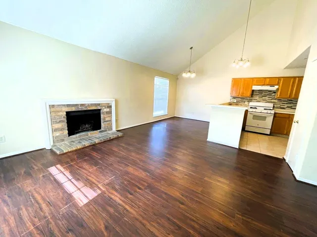 a view of a kitchen with a sink and a stove