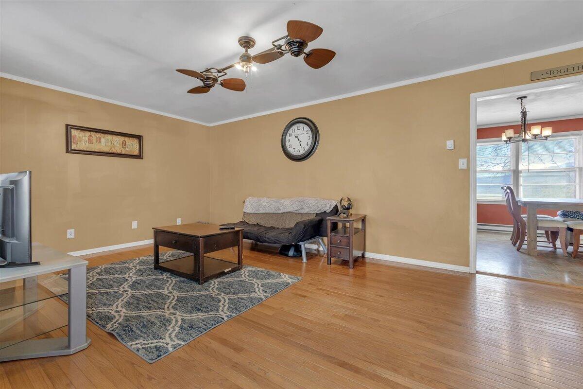 4889 Bore Auger Road Blue Ridge, VA 24064 - Photo 5 of 41 a living room with couches and a table with wooden floor