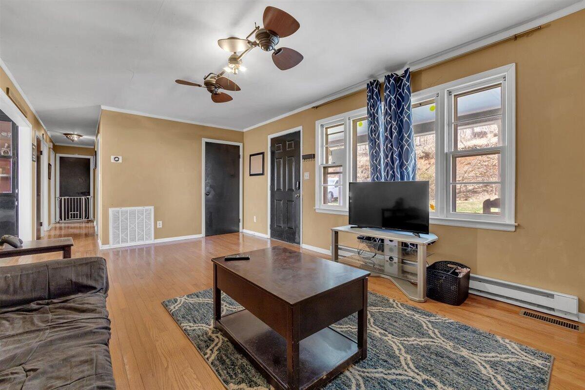4889 Bore Auger Road Blue Ridge, VA 24064 - Photo 6 of 41 a living room with furniture and a flat screen tv