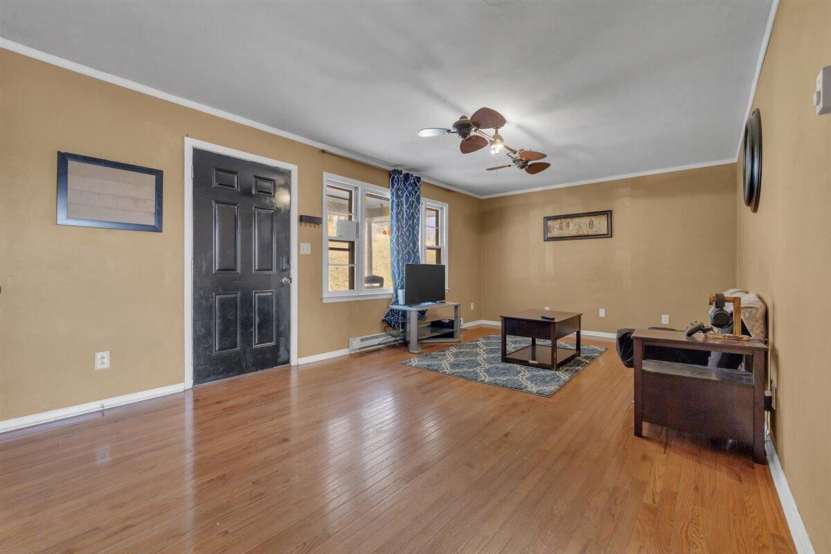 4889 Bore Auger Road Blue Ridge, VA 24064 - Photo 7 of 41 a view of a livingroom with furniture and a ceiling fan