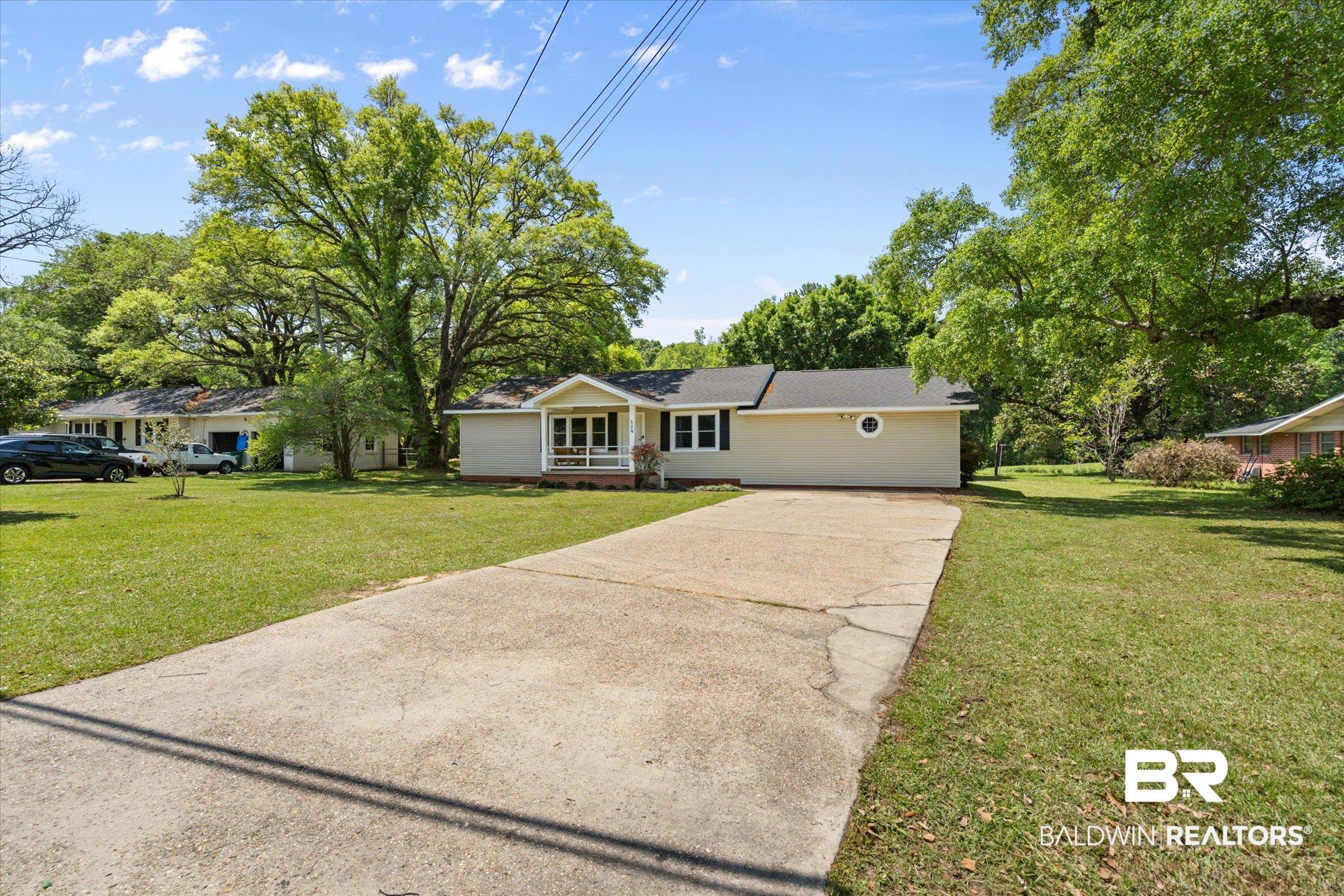 529 Cleveland Road Saraland, AL 36571 - Photo 30 of 31 Ranch-style home with a front yard and driveway