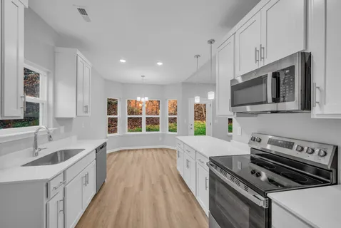 a large kitchen with a large window
