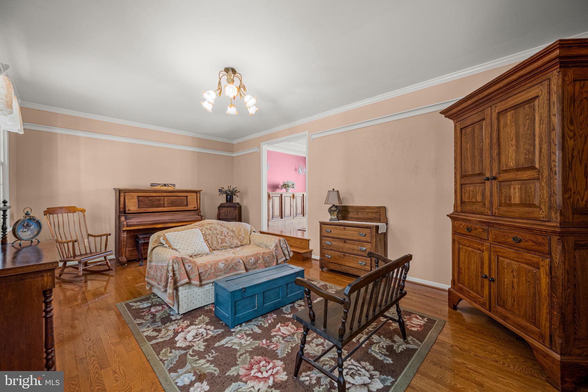 7491 Mink Hollow Road Highland, MD 20777 - Photo 21 of 67 a bedroom with furniture and wooden floor