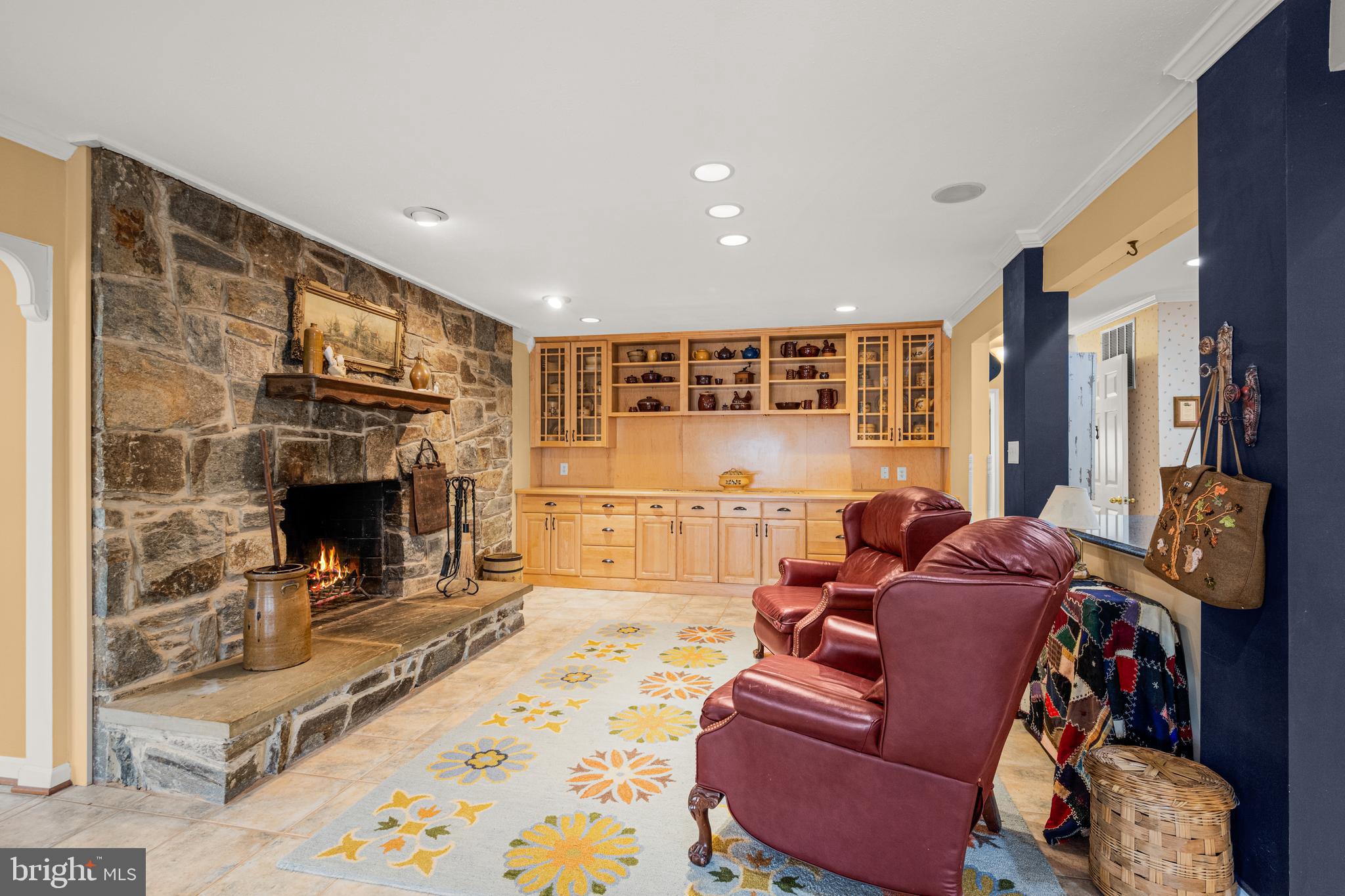 7491 Mink Hollow Road Highland, MD 20777 - Photo 24 of 67 a living room with furniture a flat screen tv and a fireplace