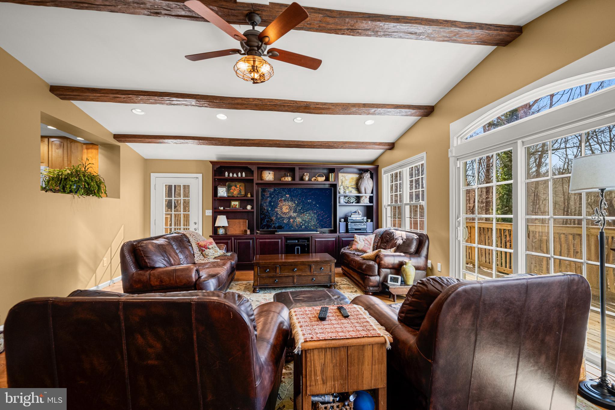 7491 Mink Hollow Road Highland, MD 20777 - Photo 30 of 67 a living room with furniture and a flat screen tv