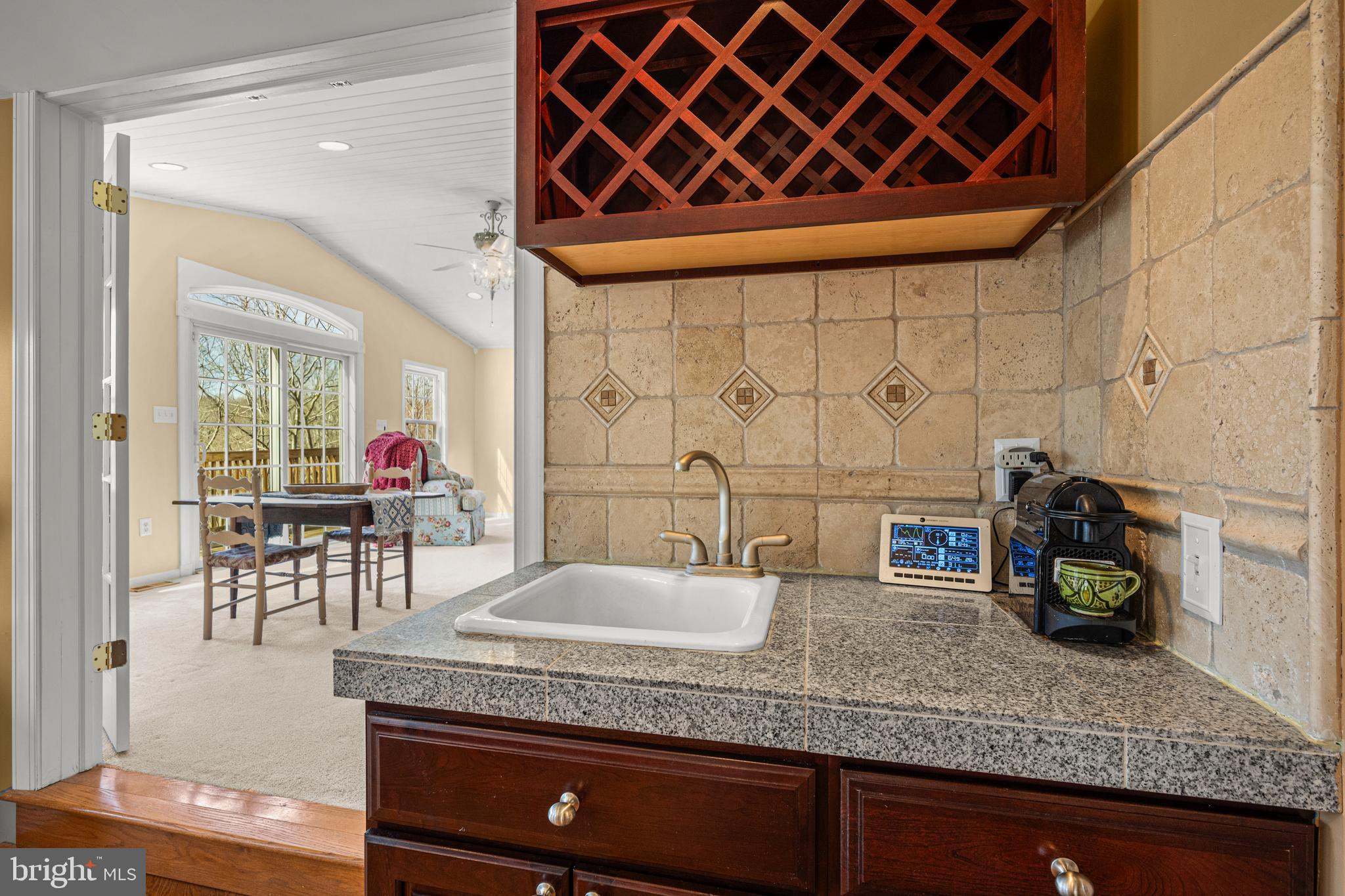 7491 Mink Hollow Road Highland, MD 20777 - Photo 31 of 67 a bathroom with a granite countertop sink and a mirror