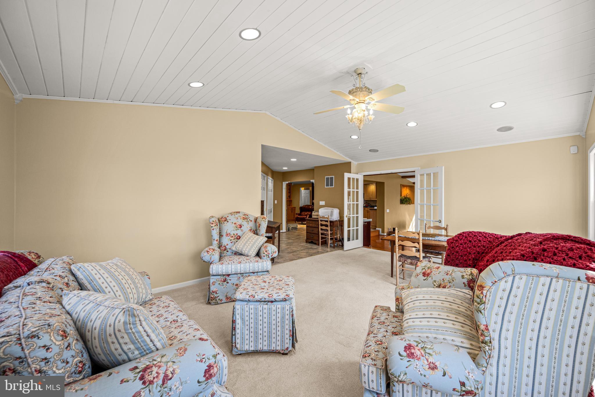 7491 Mink Hollow Road Highland, MD 20777 - Photo 33 of 67 a living room with furniture and a chandelier