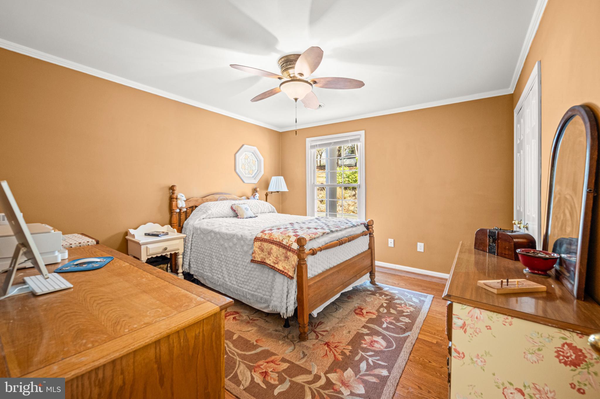 7491 Mink Hollow Road Highland, MD 20777 - Photo 38 of 67 a bedroom with a bed and a chandelier