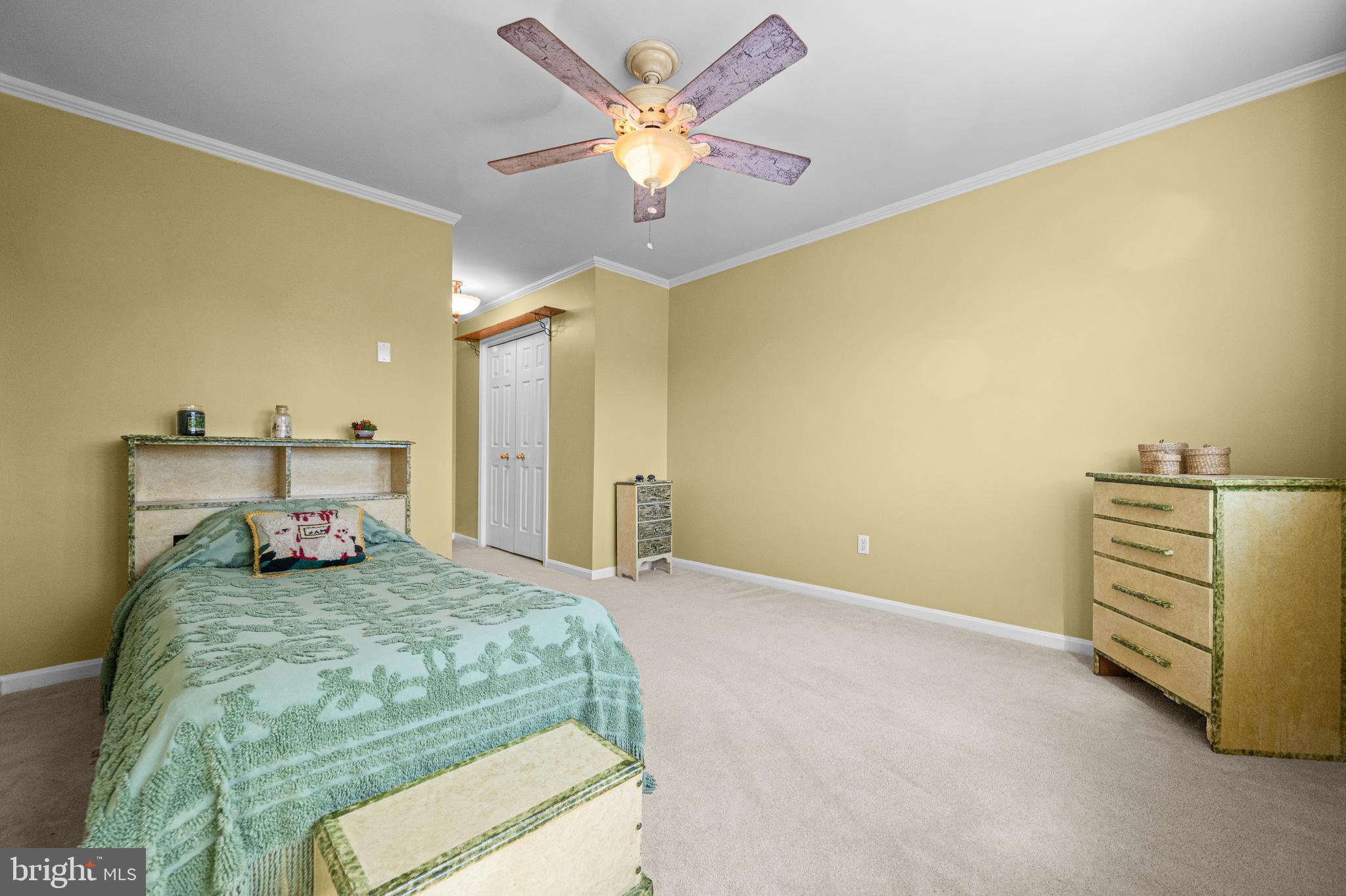 7491 Mink Hollow Road Highland, MD 20777 - Photo 40 of 67 a bedroom with a bed and a chandelier