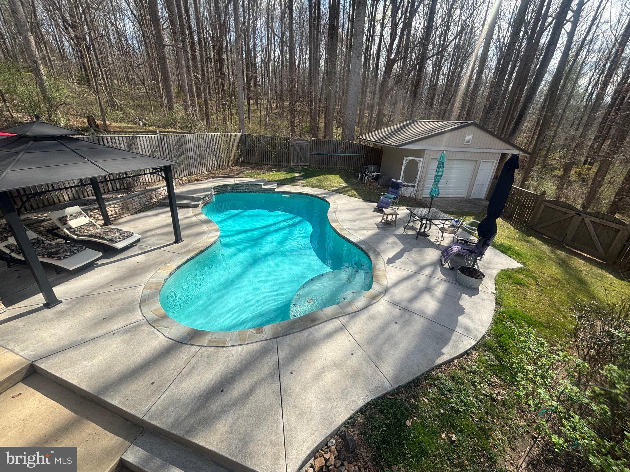 7491 Mink Hollow Road Highland, MD 20777 - Photo 5 of 67 a backyard of a house with outdoor seating