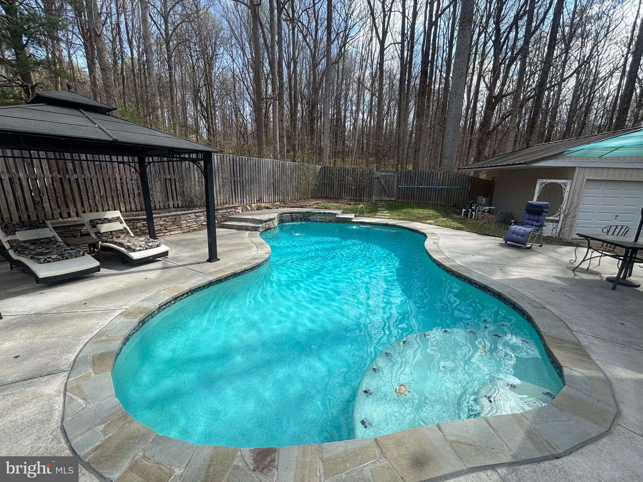 7491 Mink Hollow Road Highland, MD 20777 - Photo 60 of 67 a view of a swimming pool with sitting area